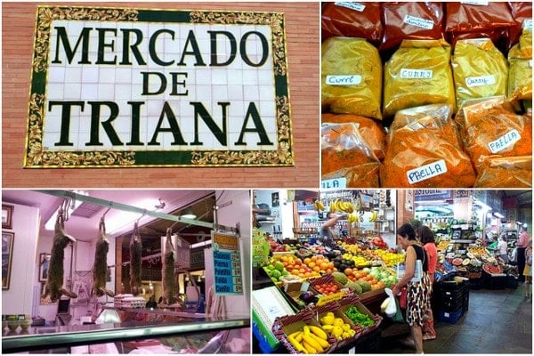 A tiled sign, bags of spices, hanging rabbits, and fruit stands at Triana Market in Seville