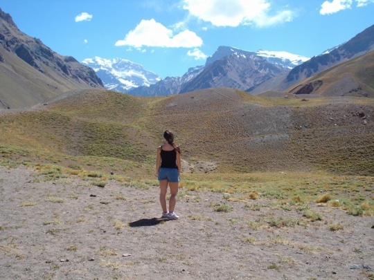 Girl looks at the mountains in Mendoza Argentina