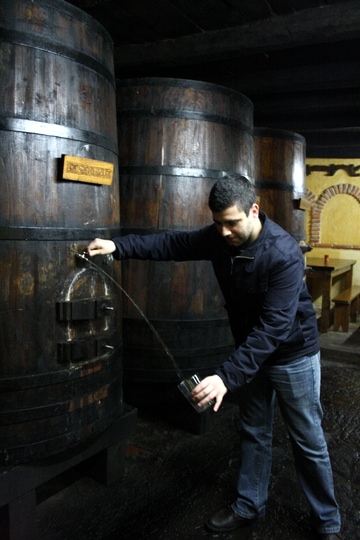 Ale pours cider at the cider house