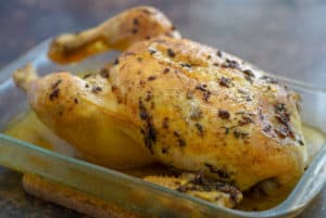 Roast chicken in a baking dish.