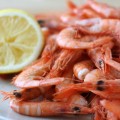 Heaping plate of boiled shrimp with lemon