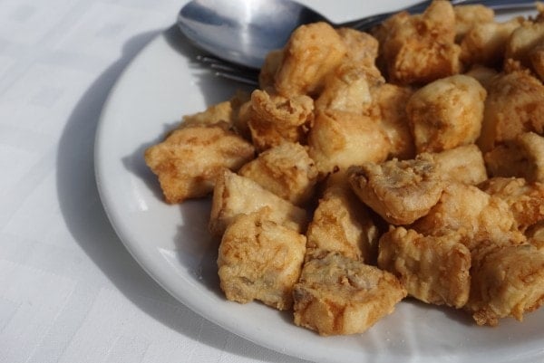 The best markets in Malaga have tapas bars where you can try local favorites like this, fried fish.