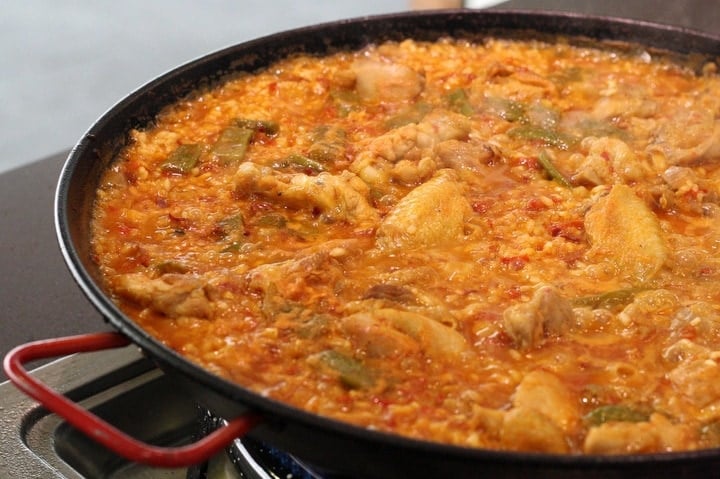 Taking a cooking class in Seville and making a paella. 