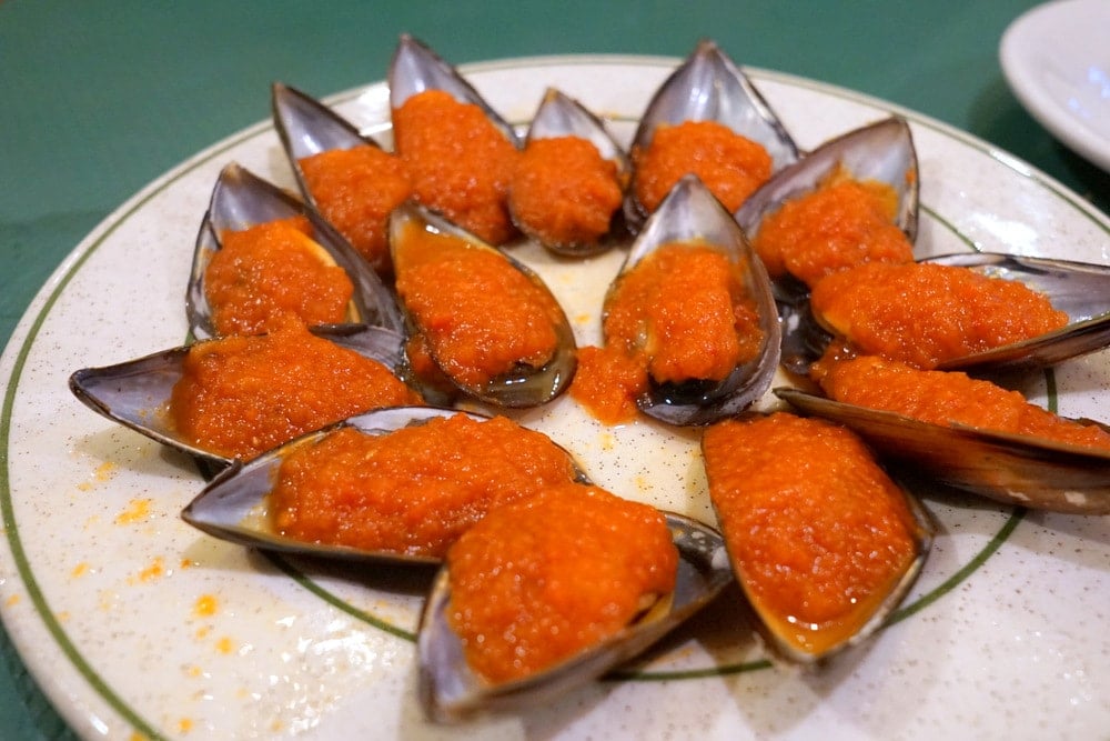 Delicious spicy Spanish mussels at an Asturian cider house-- a must try!