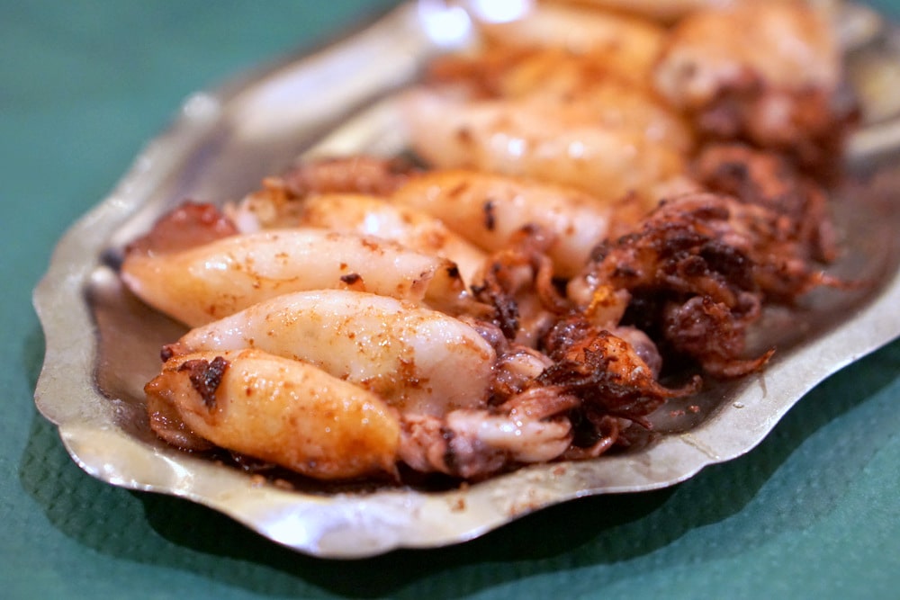 Asturias has amazing seafood-- here are some delicious grilled squid at a cider house in Ribadesella.