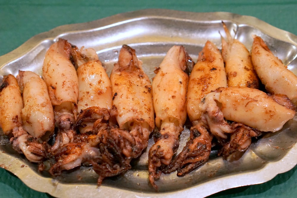 Grilled squid at an Asturian cider house in Ribadasella. The best place to eat in Ribadasella!