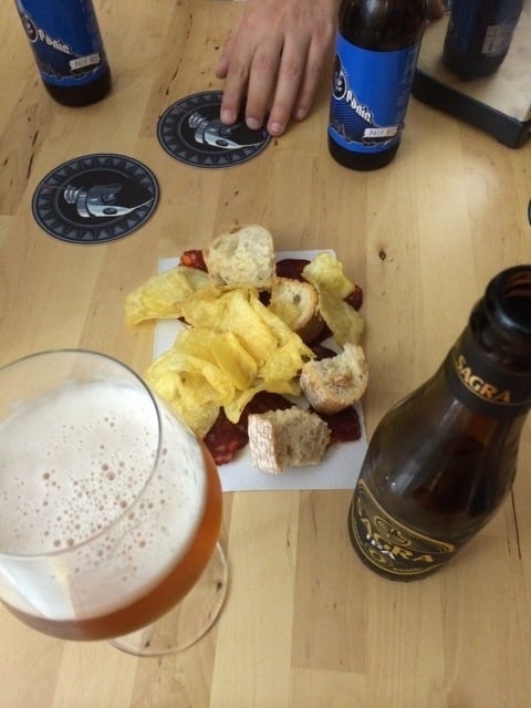 One of the places to drink craft beer in Malaga in the neighborhood of SoHo is the Rincon del Cervecero. We love that they brought us chips and chorizo! with our drinks!