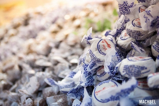 Manetcados and polvorones wrapped in wax paper at a Christmas market in Malaga