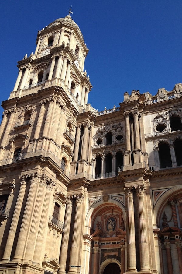 A view from the ground of Malaga's ornate cathedral with its one tower.