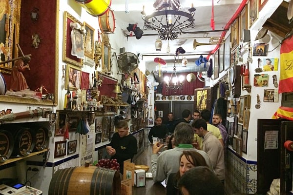 Las Merchanas, one of the best historic bars in Malaga, features a unique theme: they celebrate Holy Week all year long!