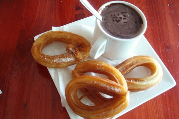 How to eat like a local in Malaga? Eat crispy churros with fresh chocolate dip!