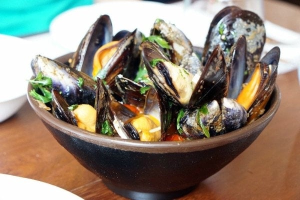 A delicious typical food in Galicia are the regional mussels. They are delicious steamed with a squeeze of lemon over the top!