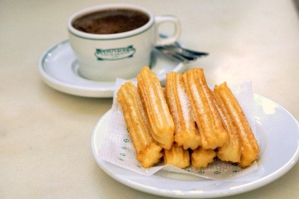 Churros sprinkled with sugar and rich hot chocolate, a traditional Spanish combination. Don't leave Galicia without trying the best churros and chocolate in Santiago de Compostela!