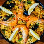 Las Perdices is one of the best places to eat paella in Granada. Great options are arroz caldoso, paella mixta, or the seafood paella seen here.