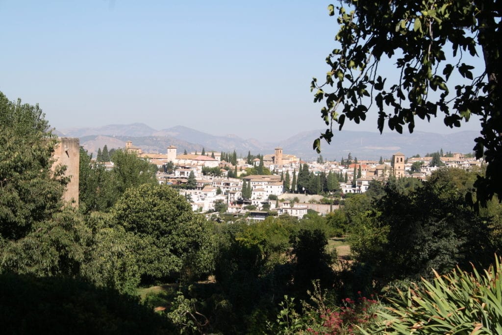 When searching for where to stay in Granada, take into account the amazing views you could get from your room if you choose the right hotel, like this view over the white houses of the city