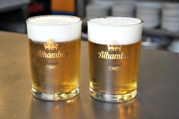 When visiting one of the historical bars in Granada, drink like a local with Alhambra beer.