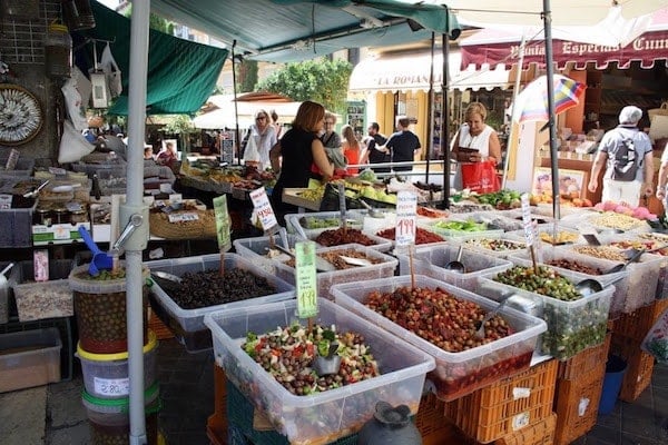 Visiting an open-air market, like the Mercado de San Agustín, is one of our favorite things to do in Granada for foodies. 