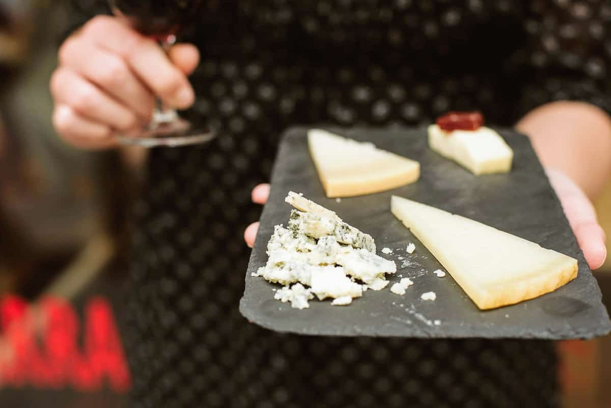 Four types of Spanish cheese on a small black tray