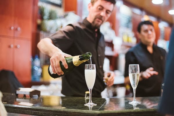 Take some time to relax and enjoy a glass of cava at the Mercado de Merced during your 10 days in Malaga—after all, you're on vacation!