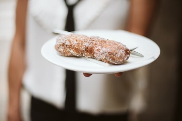 Start your Barcelona walking tour with coffee and a pastry, like this Catalan xuixo, at Forn Sarret.