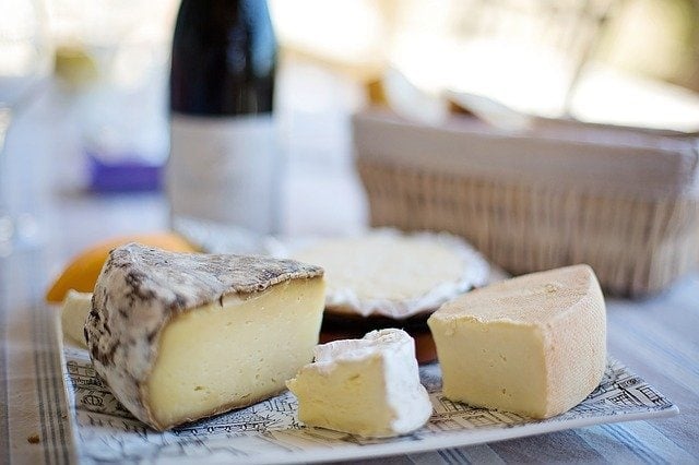 different types of cheese on a Paris food tour