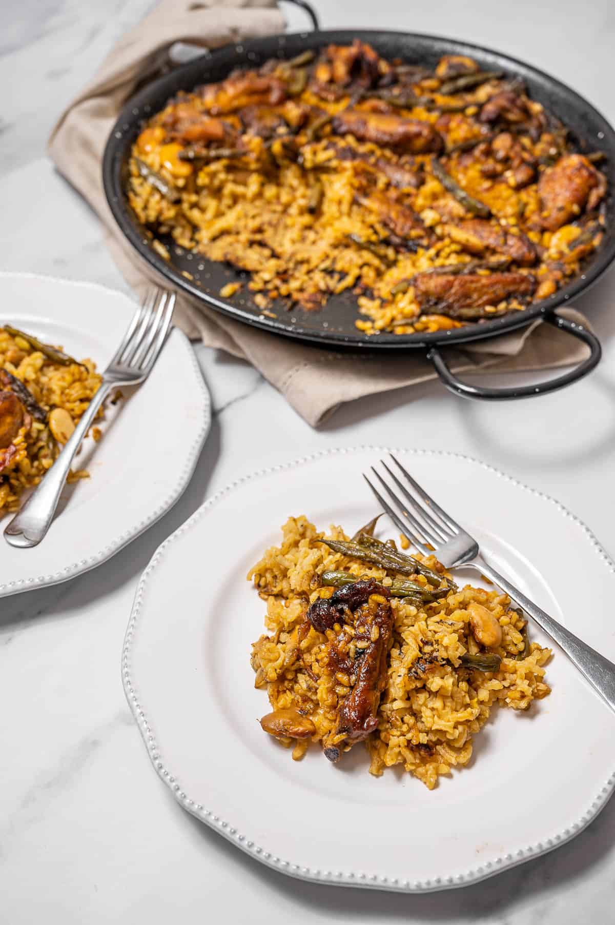 Paella Valenciana on a white plate