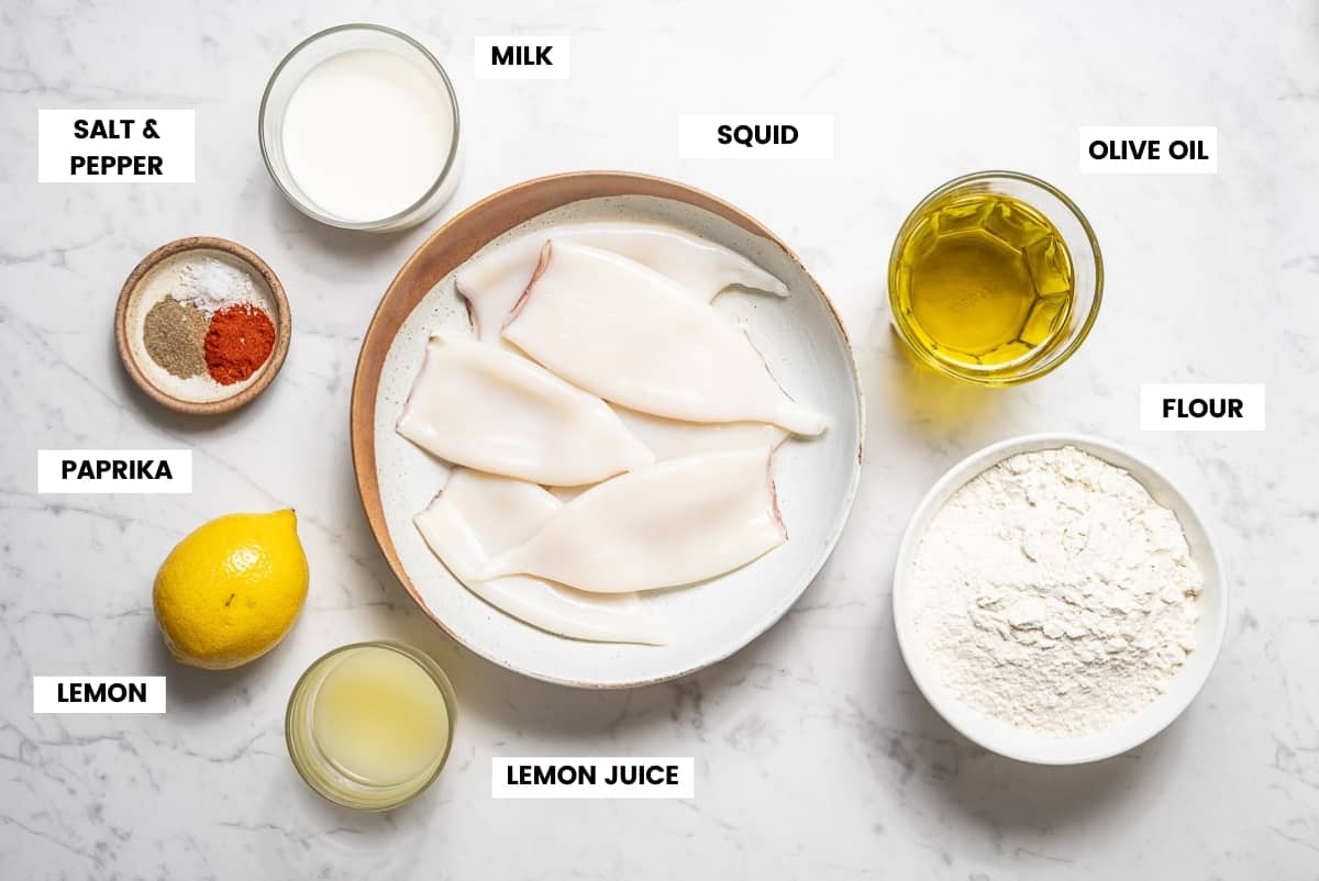 Fried calamari ingredients on a white marble counter.