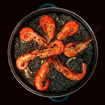 black paella in the pan
