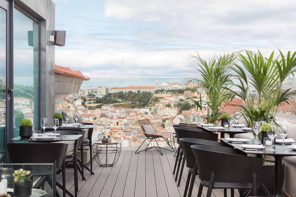 The Lumiares Hotel's rooftop restaurant terrace with a panoramic view of Lisbon