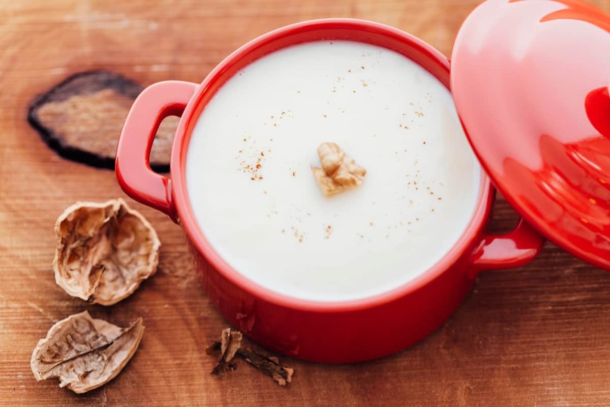 Walnut pudding in a red serving pot