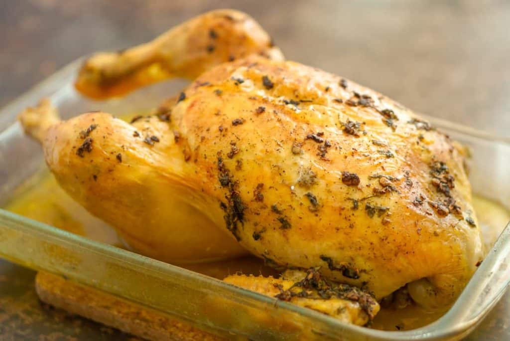 Roast chicken in a baking dish.