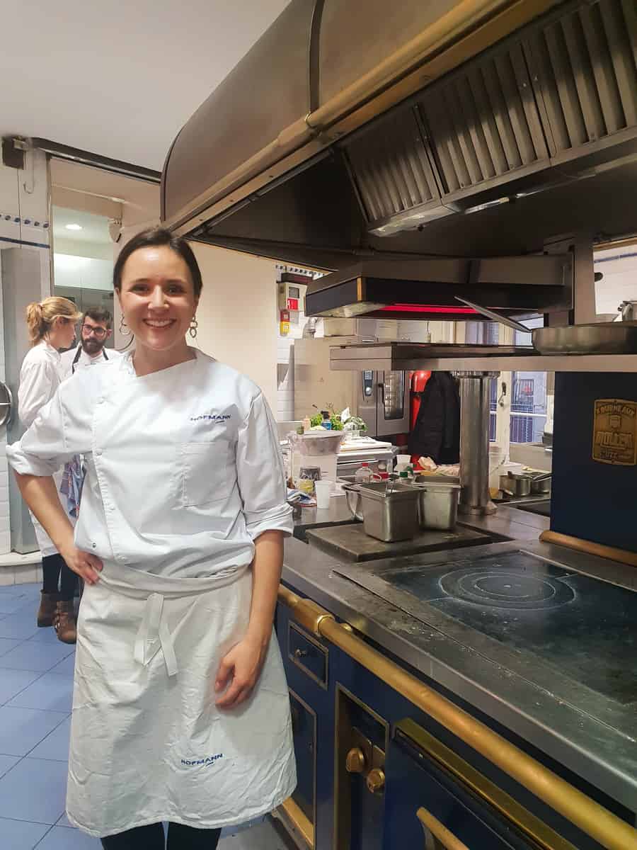 Lauren Aloise in a culinary school kitchen