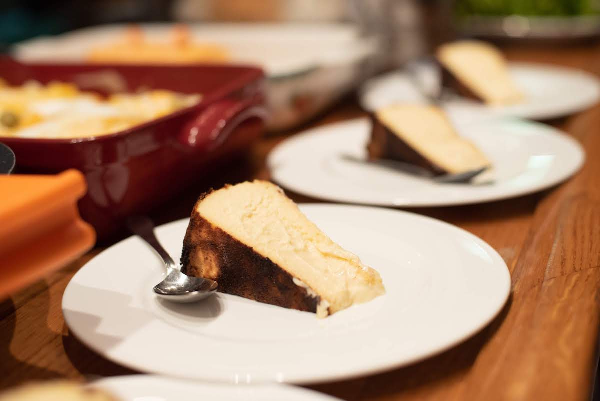 Individual slices of crustless caramelized cheesecake on plates.