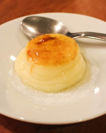 Spanish flan on a white plate