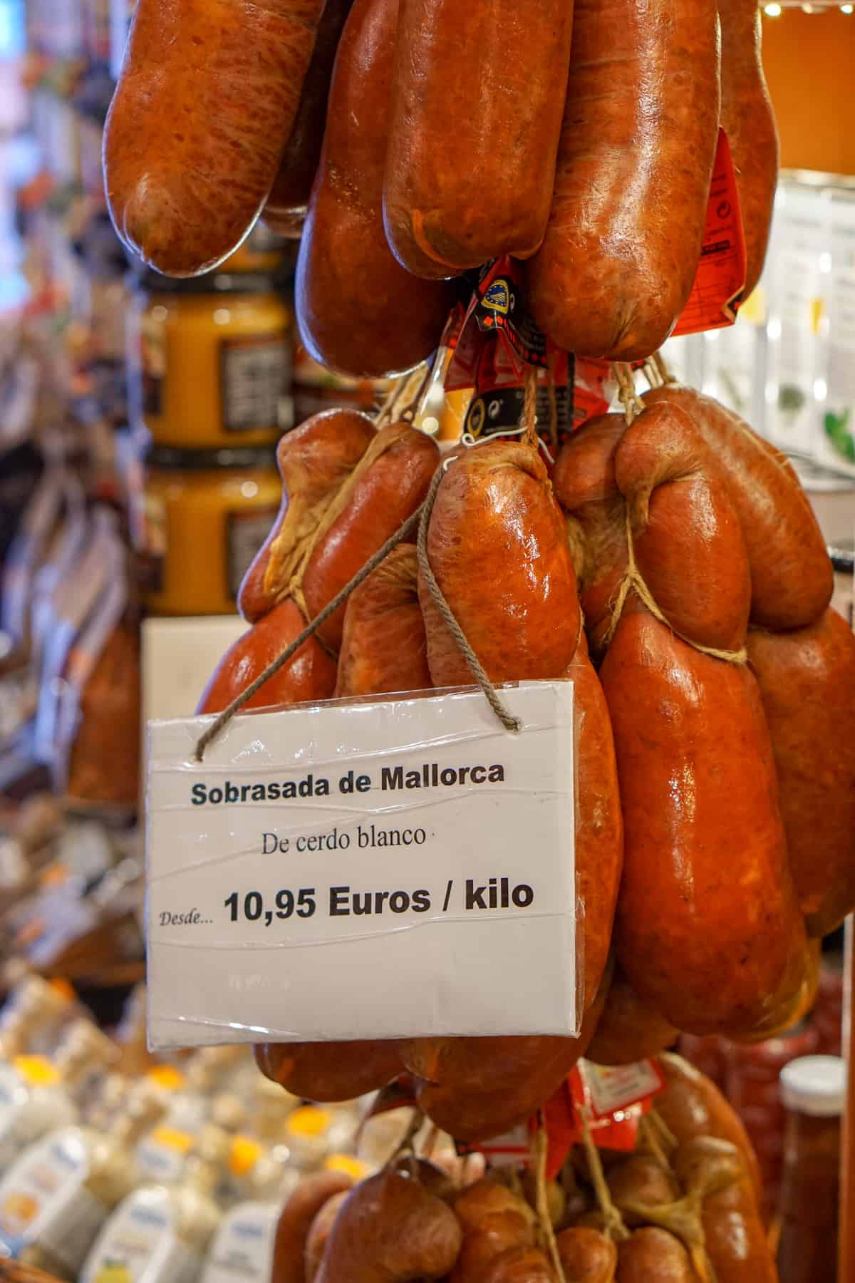 Mallorcan sobrassada hanging in a shop