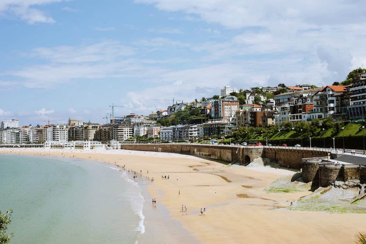 A beach in San Sebastian, Spain surrounded by beautiful buildings