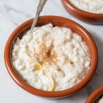 bowl of arroz con leche with a spoon.