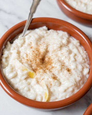 bowl of arroz con leche with a spoon.