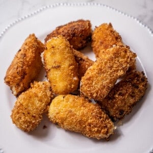 small white plate of croquetas de jamón.