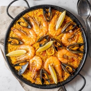 large shallow pan filled with seafood paella.