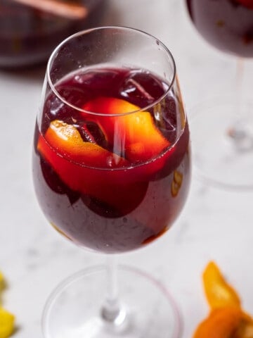 stemmed wineglass of traditional sangria.
