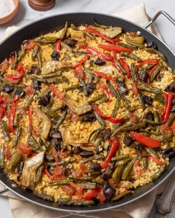 large shallow pan of vegetable paella.