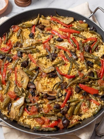 large shallow pan of vegetable paella.