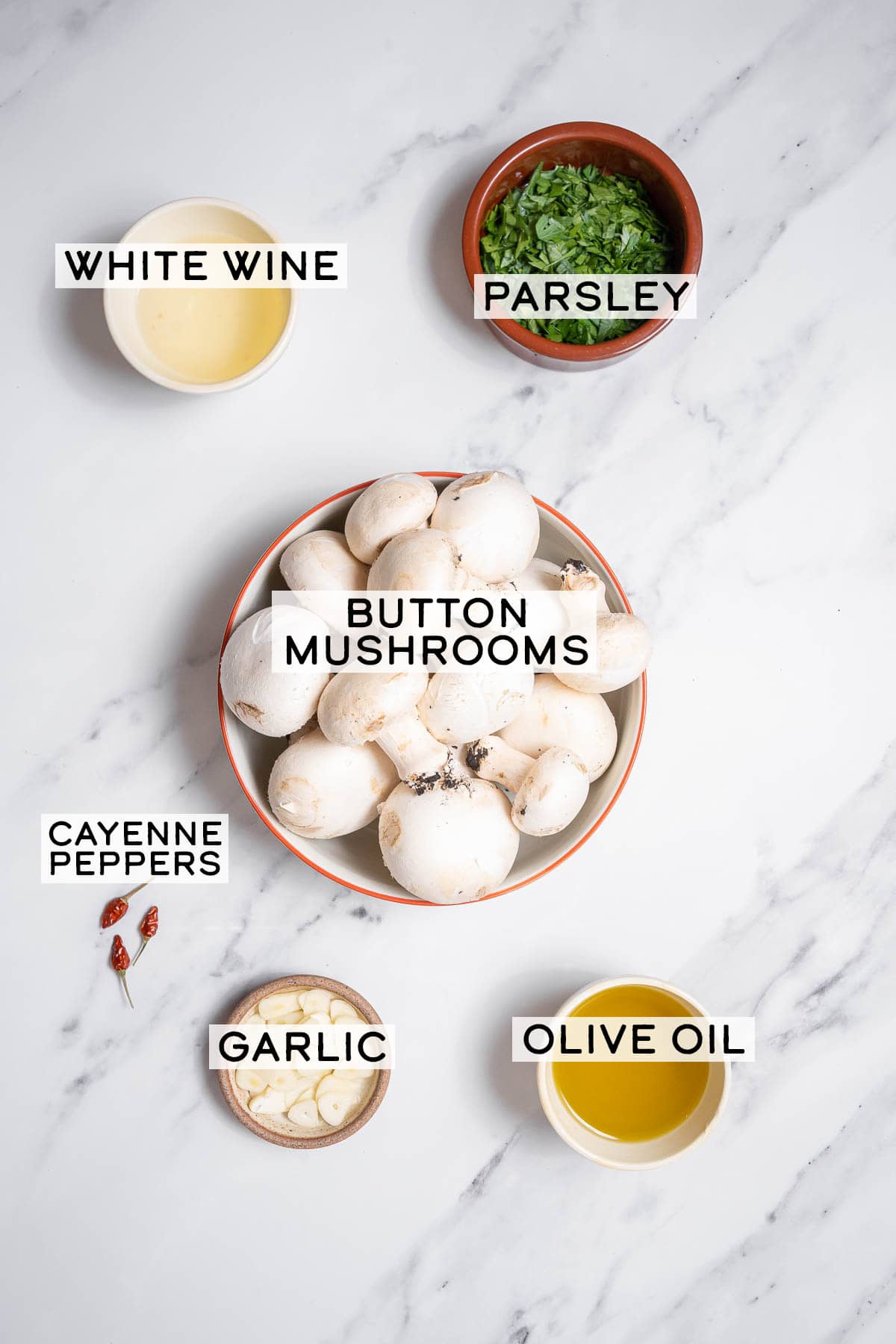 bowls of ingredients for Spanish garlic mushrooms.