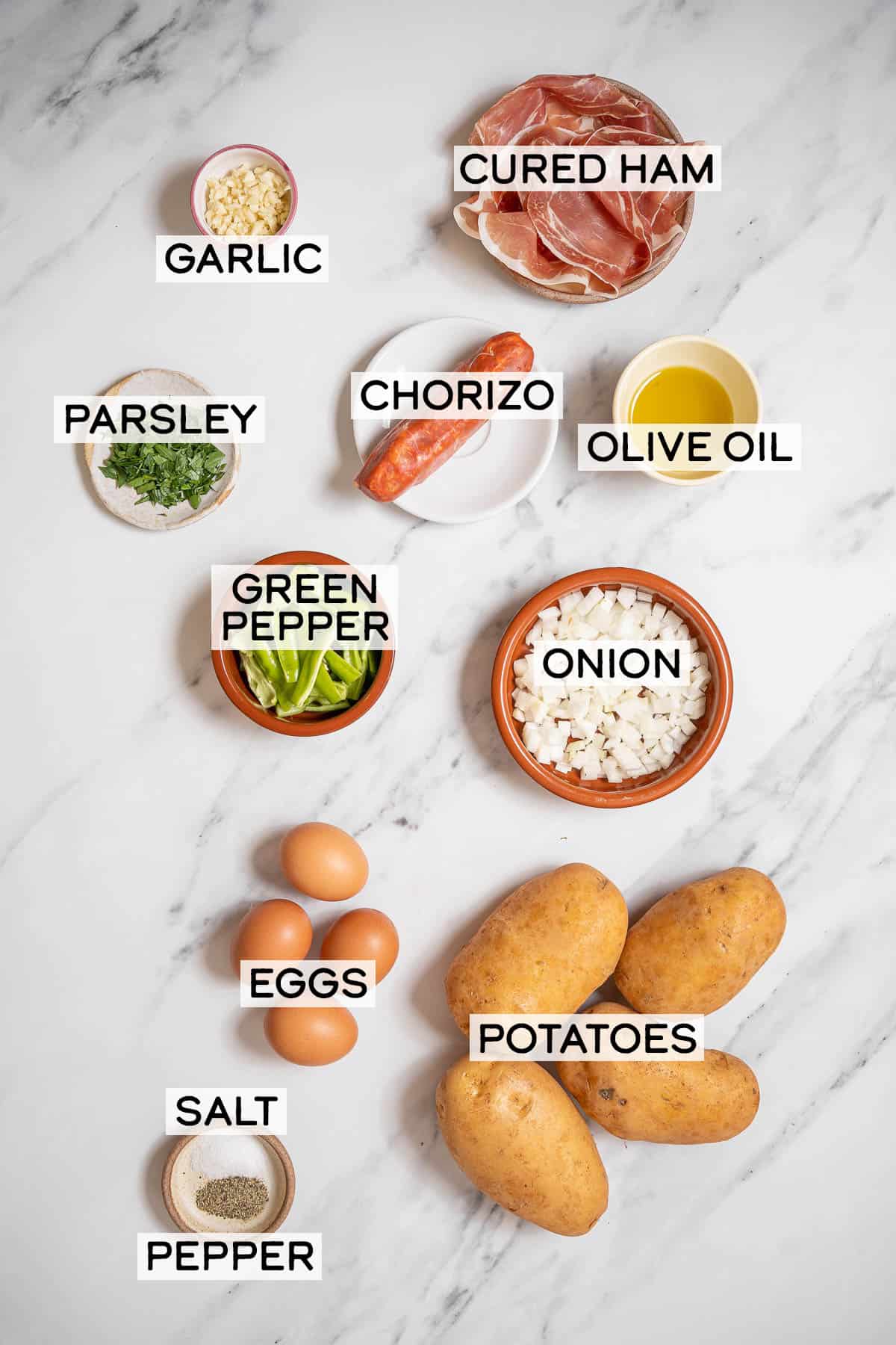 bowls of ingredients for huevos rotos.