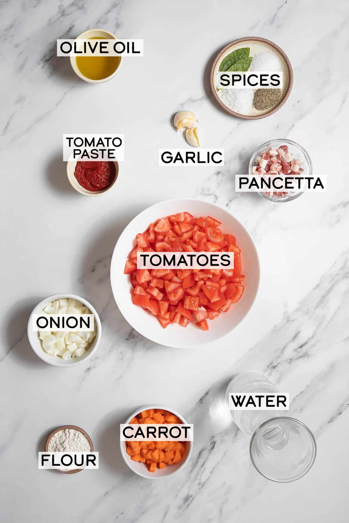 bowls of ingredients for salsa de tomate.