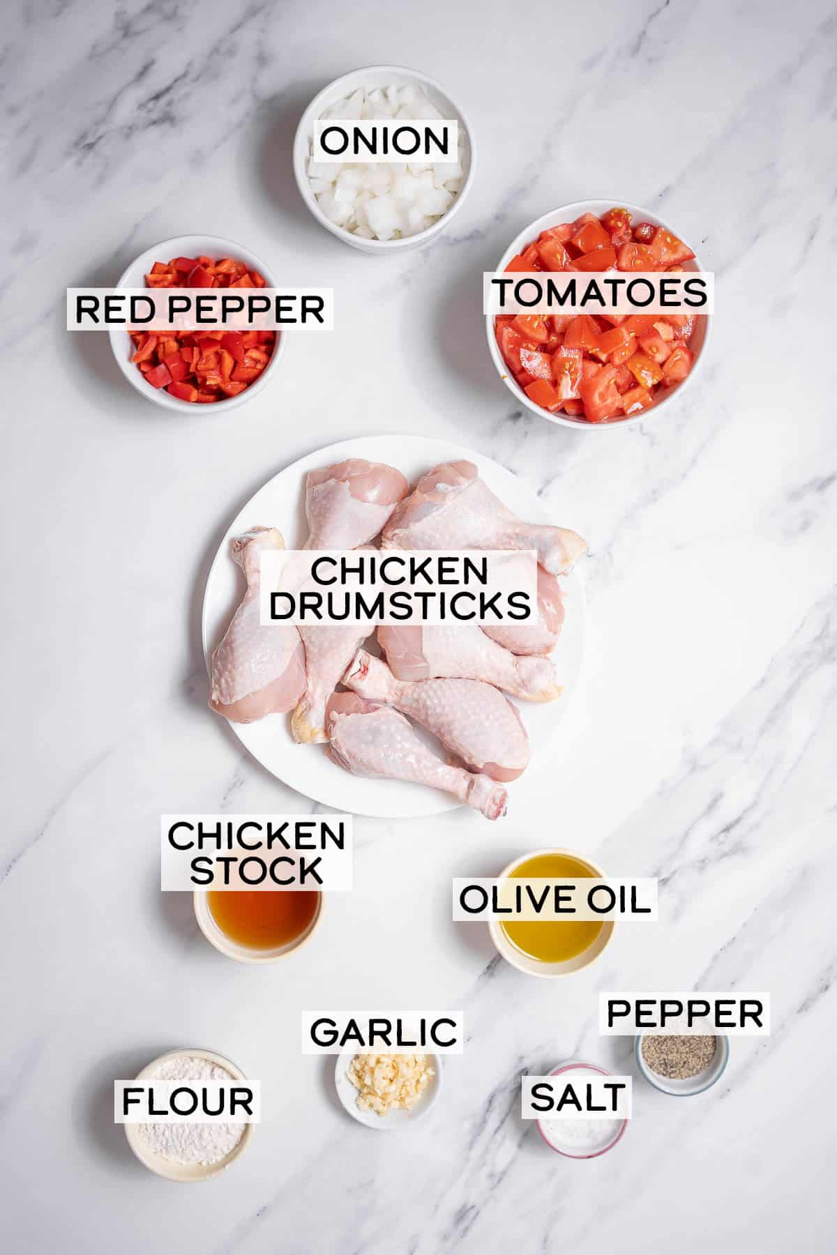 bowls of ingredients for chicken with tomatoes.