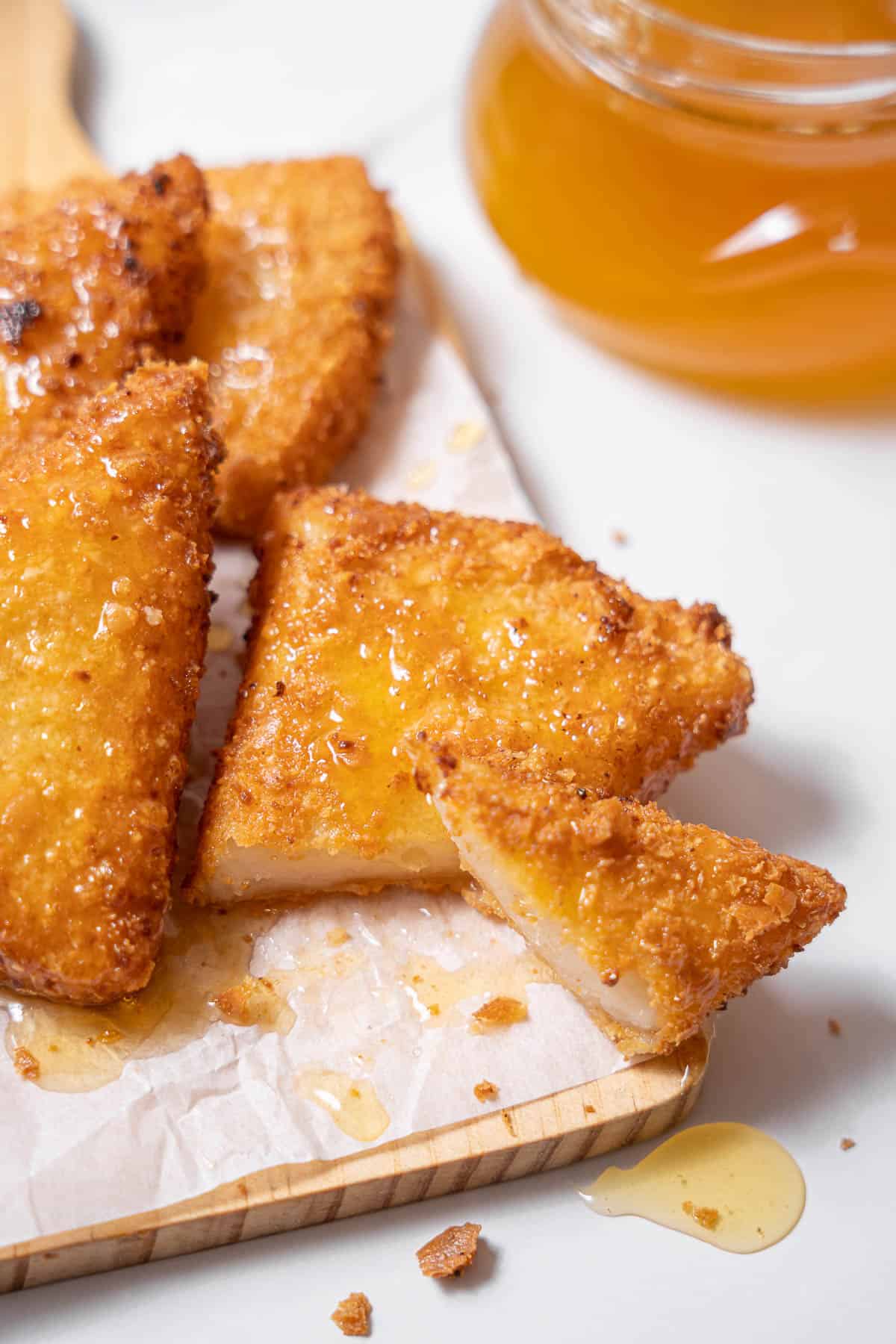 slices of fried goat cheese with honey.