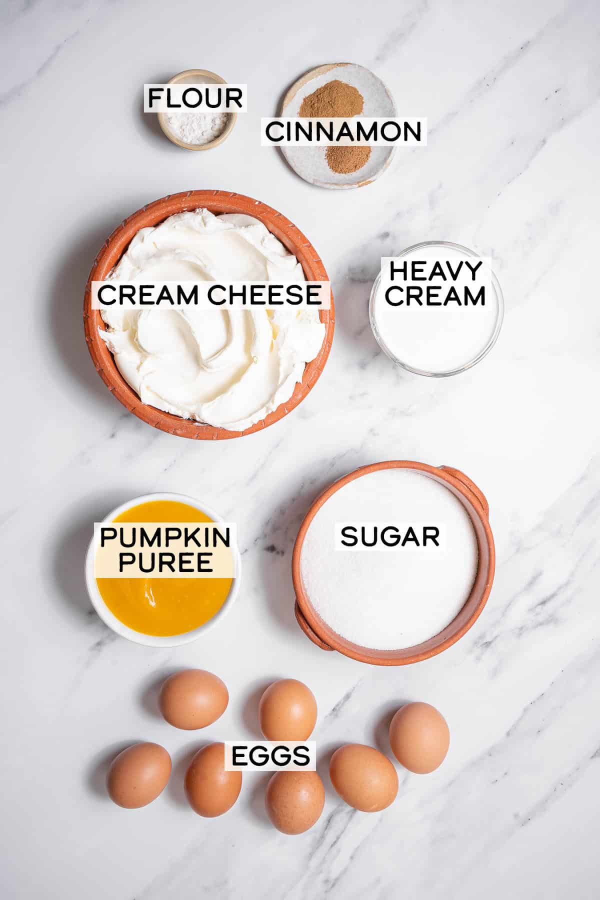 bowls of ingredients for crustless pumpkin cheesecake.