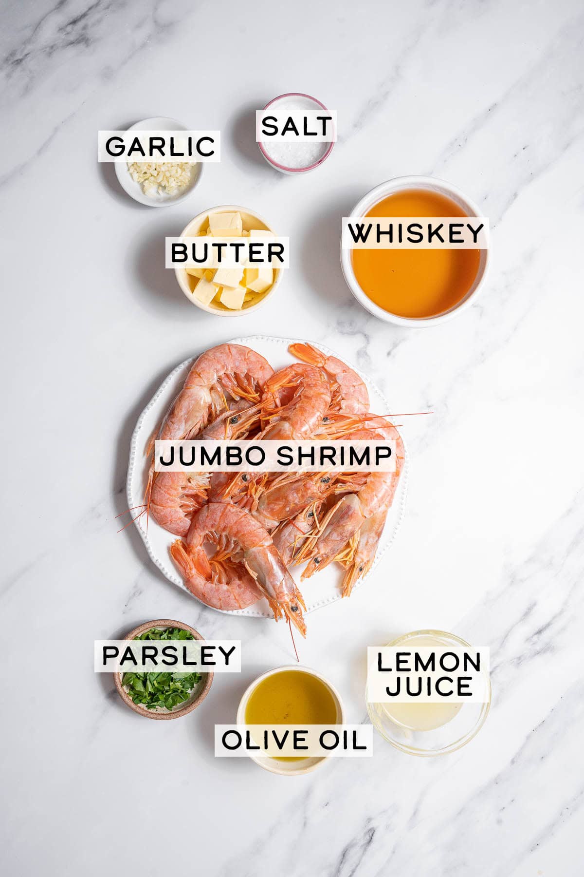 bowls of ingredients for shrimp in whiskey sauce.